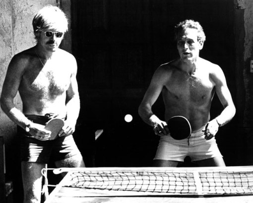 Taking a break on the set of Butch Cassidy and the Sundance Kid, Newman plays ping-pong with co-star Robert Redford, 1969. From the Everett Collection.
