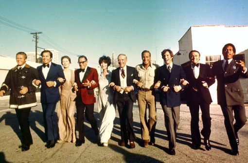 The star-studded cast of the 1974 film The Towering Inferno included, from left, Steve McQueen, Robert Wagner, Faye Dunaway, William Holden, Jennifer Jones, Fred Astaire, Newman, Richard Chamberlain, Robert Vaughn, and O. J. Simpson. From Twentieth Century Fox Film Corp./Photofest.